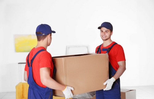 Professional movers handling a Battersea home relocation with careful packing