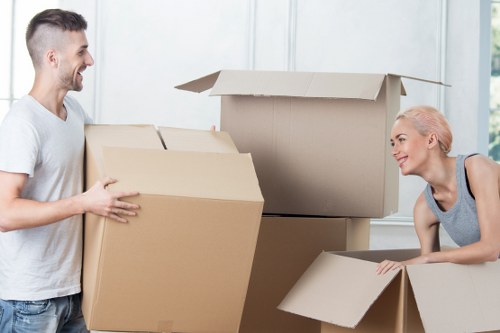 Business team preparing for an office move with labeled boxes and logistics planning