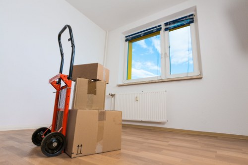 Professional movers handling bulky furniture in Battersea