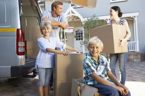 Local movers handling furniture and equipment during a Battersea commercial move